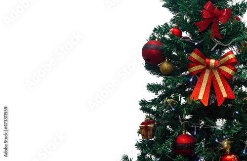 Close up of decorations on a Christmas tree with lights on