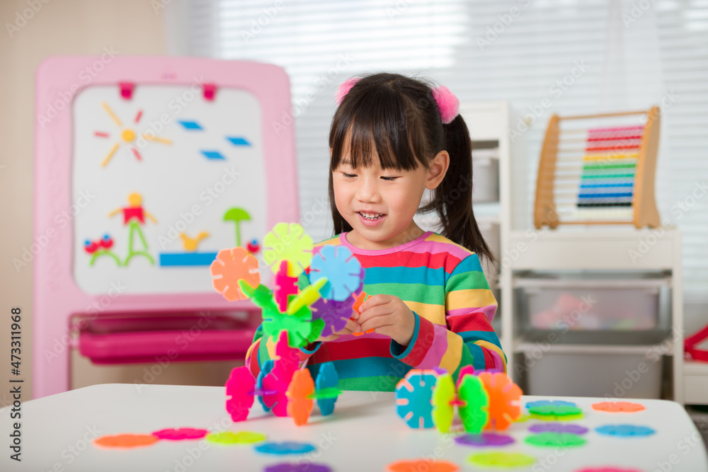 young irl playing creative toy blocks at home young irl playing creative toy blocks at home
