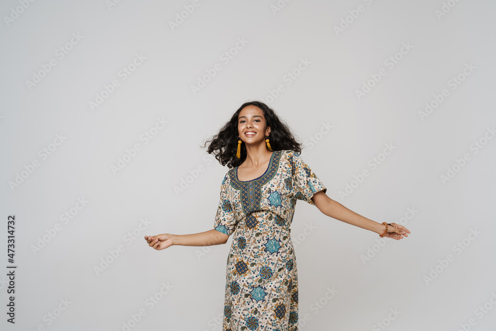 Young south asian woman wearing dress dancing on camera Young south asian woman wearing dress dancing on camera