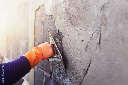 Картината върху платно Concrete plasterers to create industrial workers background walls with plastering tools