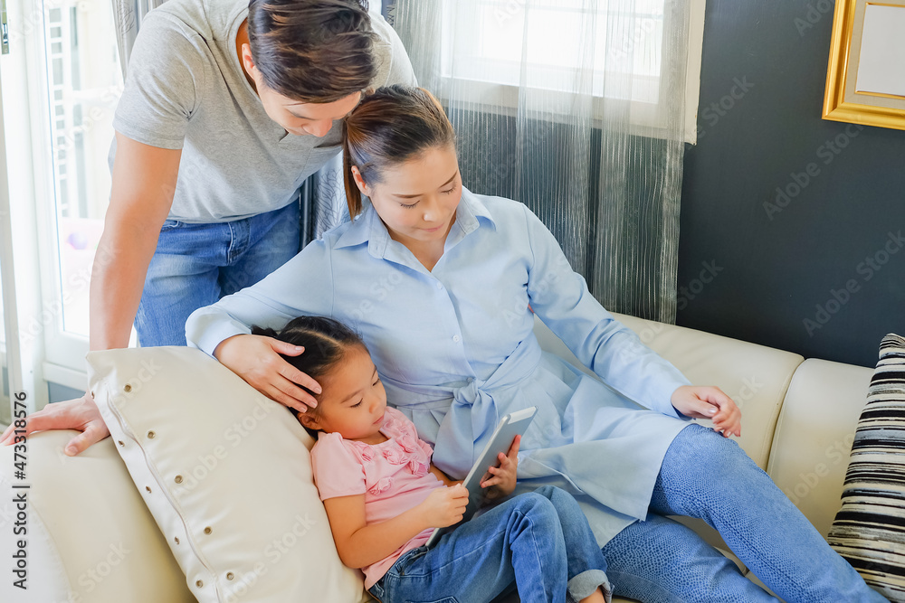 Obraz premium happy Asia family on sofa in living room