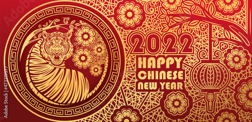 Chinese new year 2022, year of the tiger banner with gold tiger zodiac and gold flower and asian elements paper cut with craft style.