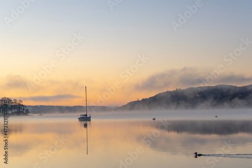 Sunrise on Windermere with boats