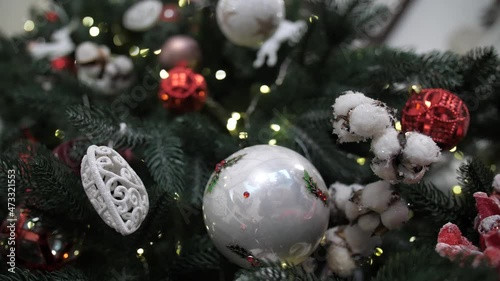 A christmas tree in a room. New Year 2022
