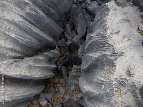 changes, sharpness, formations, crevices, corrugated and sharp structures in stones photo