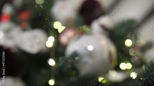 A christmas tree in a room. New Year 2022