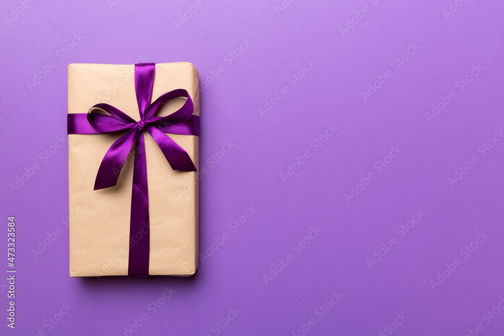 Holiday present box over colored background, top view. Copy space for design Holiday present box over colored background, top view. Copy space for design