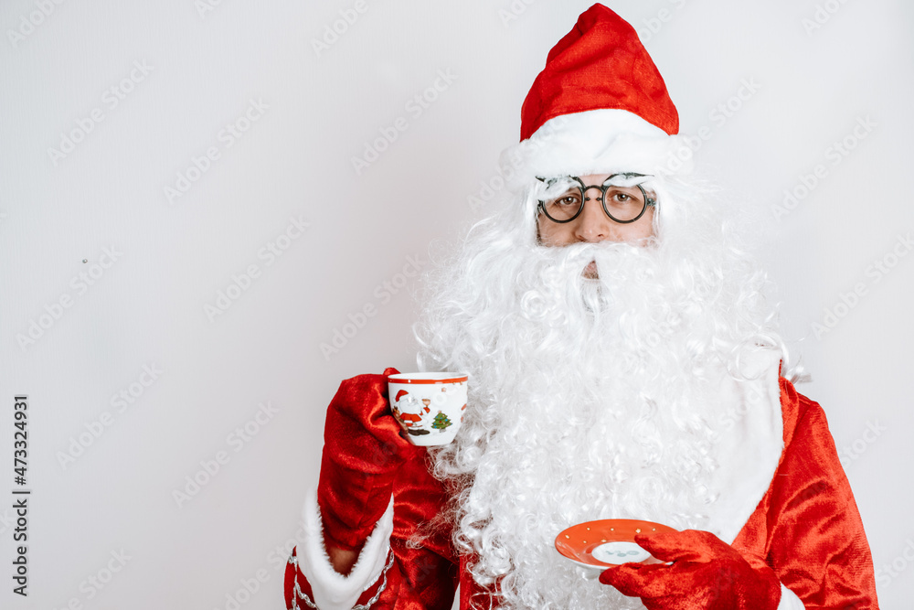 Santa Claus drinking tea closeup portrait Isolated on white background