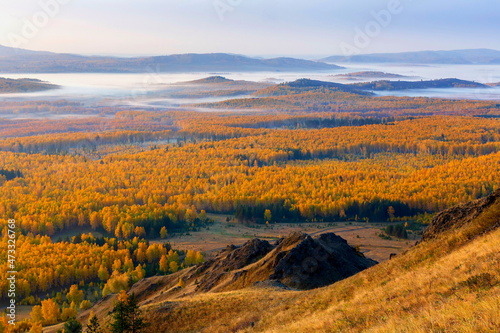 Magnificent views of the Nurali ridge in the rays of morning dawn on an autumn day photo