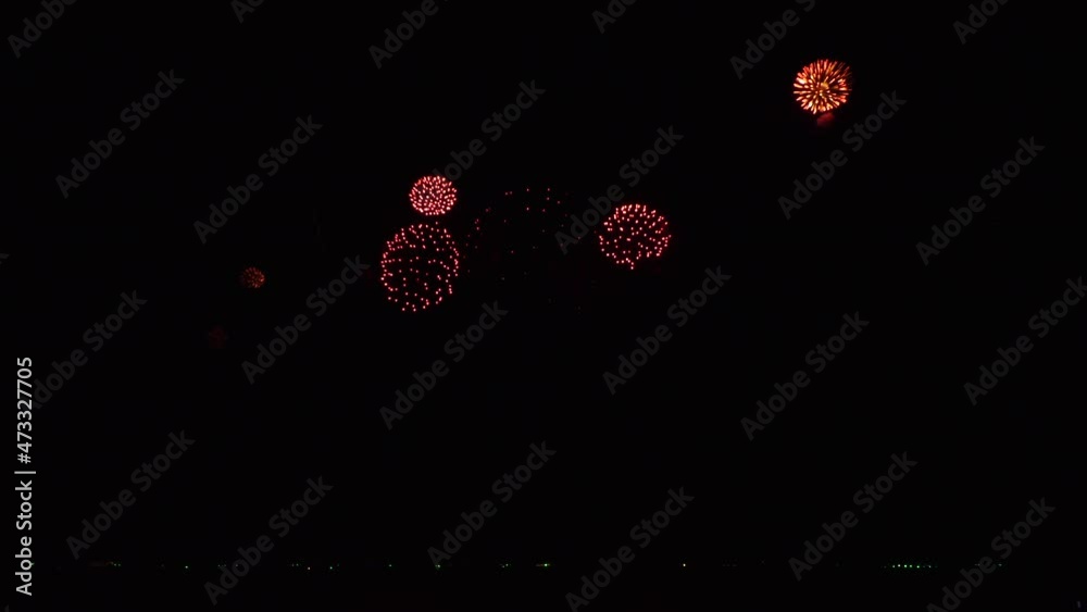 4K. loop seamless of real fireworks background. abstract blur of real golden shining fireworks with bokeh lights in the night sky. glowing fireworks show. New year's eve fireworks celebration 4K. loop seamless of real fireworks background. abstract blur of real golden shining fireworks with bokeh lights in the night sky. glowing fireworks show. New year's eve fireworks celebration