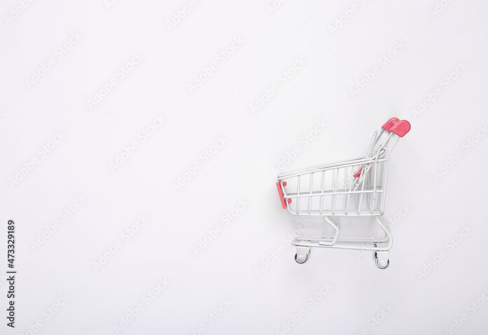 Mini supermarket trolley on white background