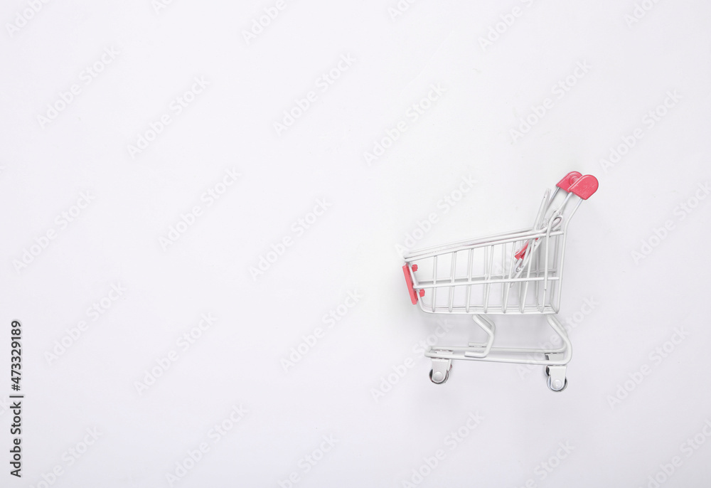Mini supermarket trolley on white background Mini supermarket trolley on white background