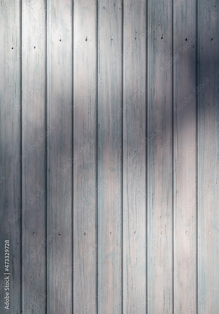 Front view of an old weathered and painted wooden wall or wood paneling. Abstract high resolution full frame textured background. Front view of an old weathered and painted wooden wall or wood paneling. Abstract high resolution full frame textured background.