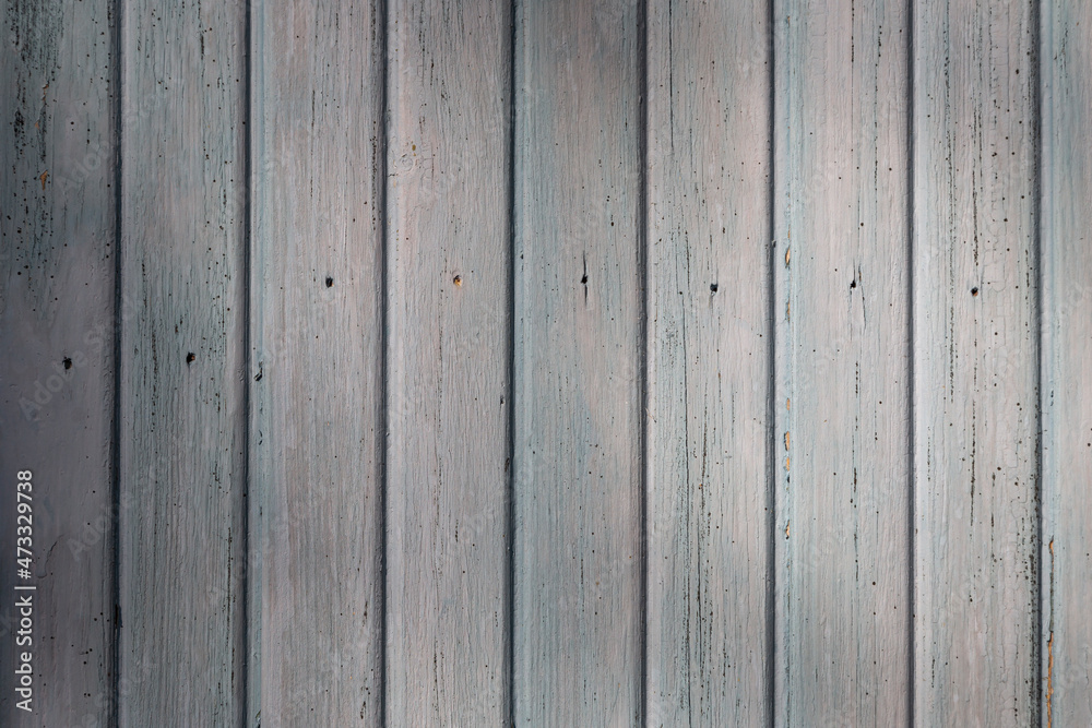Front view of an old weathered and painted wooden wall or wood paneling. Abstract high resolution full frame textured background. Front view of an old weathered and painted wooden wall or wood paneling. Abstract high resolution full frame textured background.