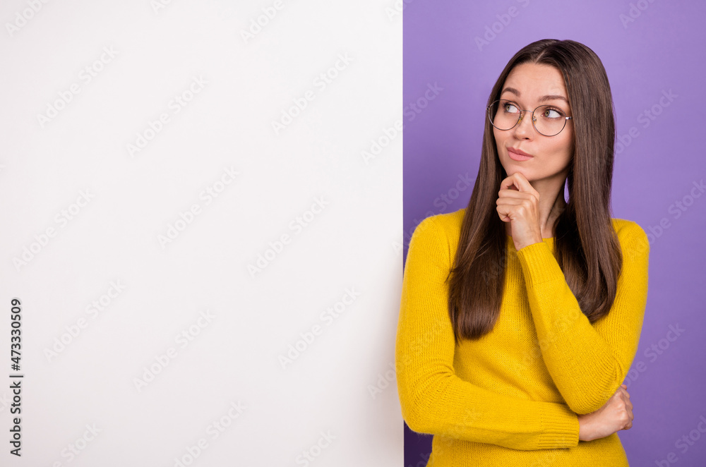 Photo of young curious girl minded hmm look empty space advert thoughtful isolated over purple color background Photo of young curious girl minded hmm look empty space advert thoughtful isolated over purple color background