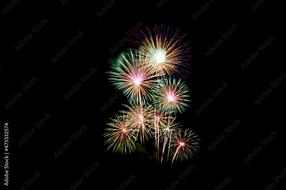 Many flashing colorful fireworks in event amazing with black background celebrate New Year, holiday and festival in night.