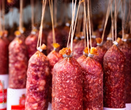 appetizing sausages on the counter of the sausage section of the supermarket photo