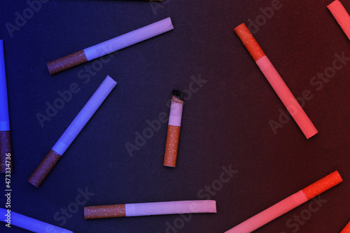 Background from many cigarettes on black background.