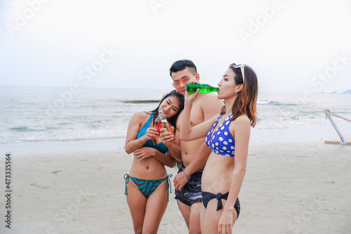 sexy bikini party seaside enjoy meeting group friends having fun dancing and drinking beverage on the beach, happy life on summer season © u photostock