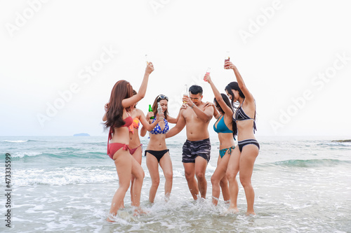 sexy bikini party seaside enjoy meeting group friends having fun dancing and drinking beverage on the beach, happy life on summer season