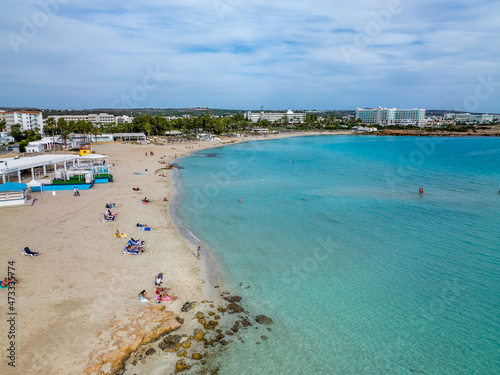 Fototapeta Naklejka Na Ścianę i Meble -  Nissi Beach in Ayia Napa, clean aerial photo of famous tourist beach in Cyprus, the place is a known destination on island and is formed from a smaller island just near the main shore