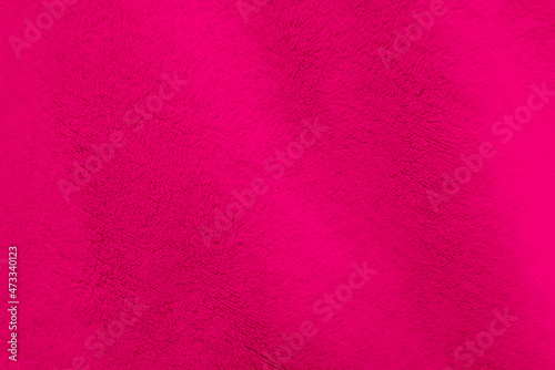 Pink clean wool texture background. light natural sheep wool. pink seamless cotton. texture of fluffy fur for designers. close-up fragment pink wool carpet..
