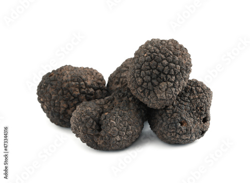 Fresh whole black truffles isolated on white