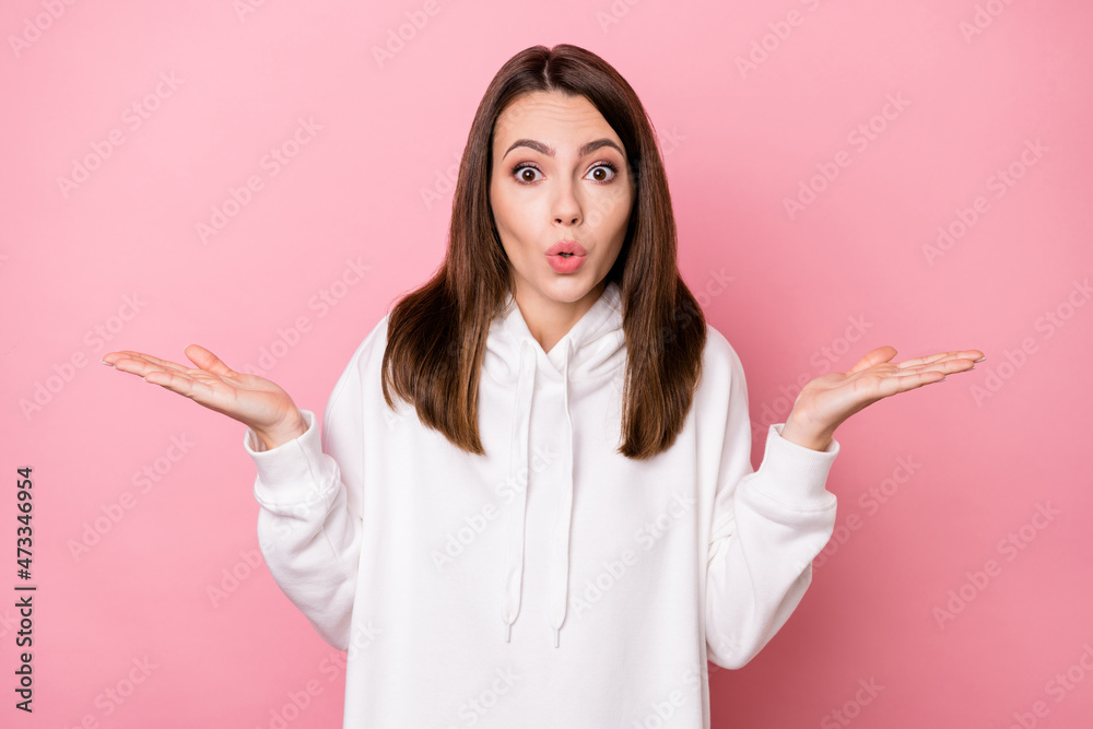 Photo of impressed clueless young woman dressed white sweatshirt shrugging shoulders isolated pink color background Photo of impressed clueless young woman dressed white sweatshirt shrugging shoulders isolated pink color background