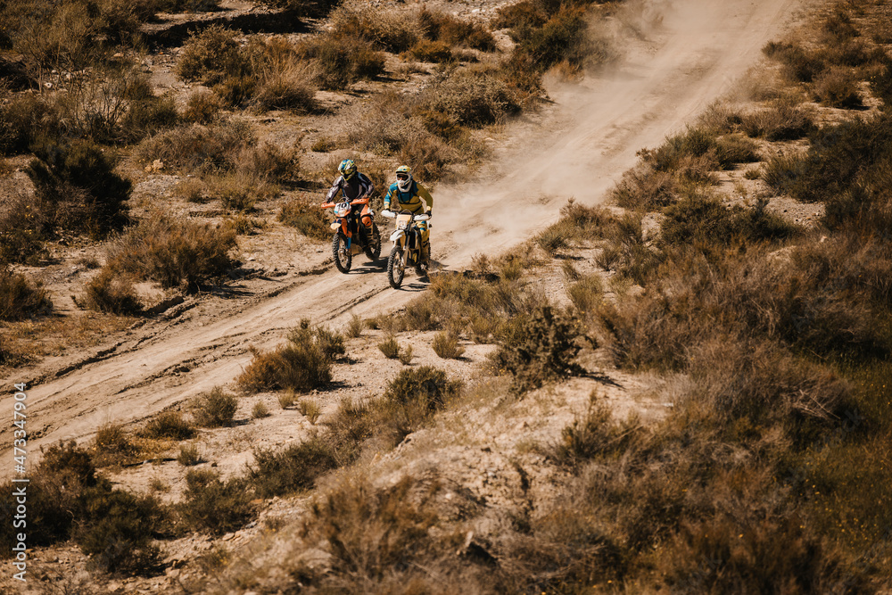 Bikers riding motorcycles at desert Bikers riding motorcycles at desert