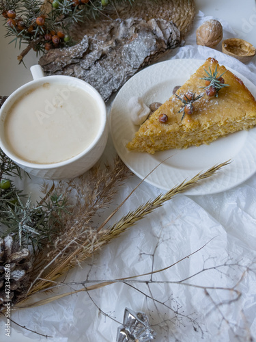 Coffee and cake. Still life with slice of apple pie, cup of latte coffee and pine bark sprinkled with powdered sugar