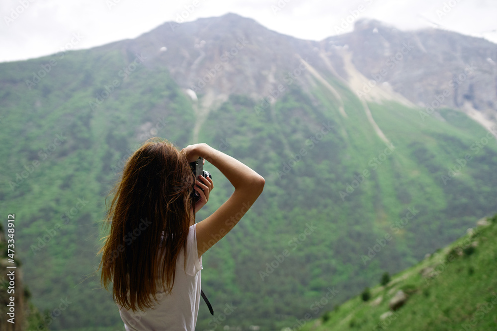 Naklejka premium woman photographer travel mountains nature adventure landscape