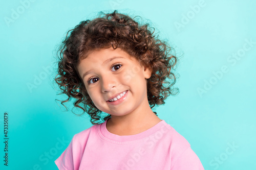 Portrait of attractive cheerful wavy-haired girl posing good mood isolated over bright teal turquoise color background