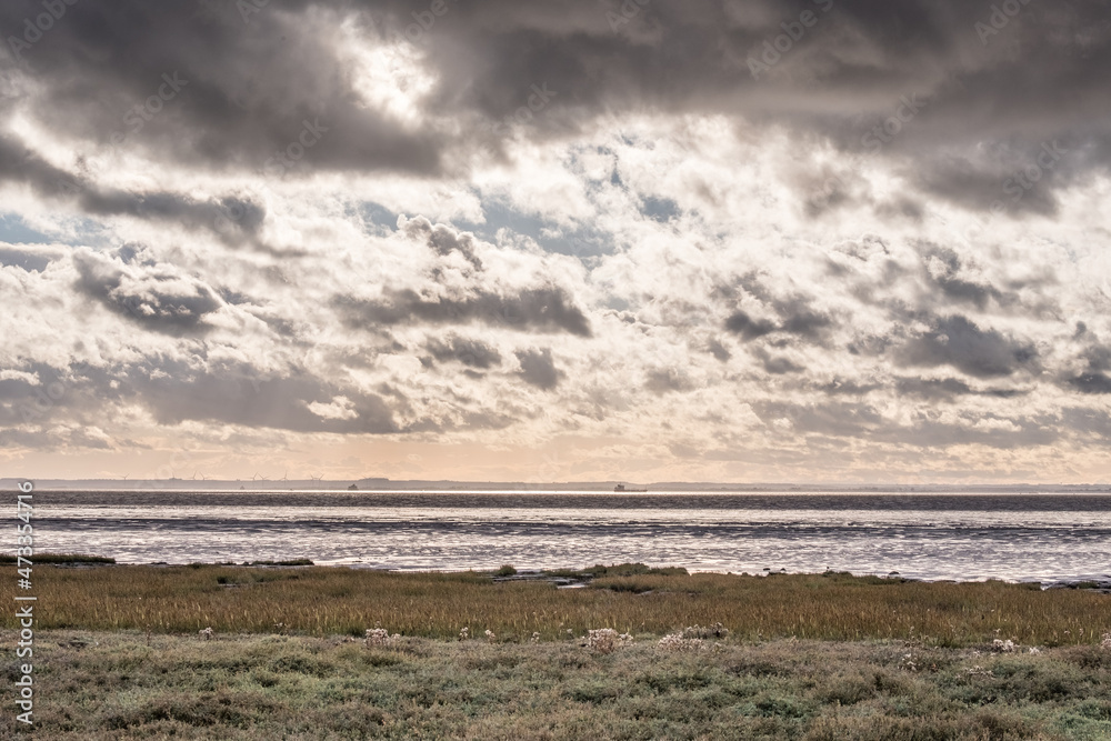 Dramatic sky over a river estuary Dramatic sky over a river estuary
