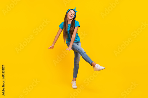 Fototapeta Naklejka Na Ścianę i Meble -  Full body photo of young pretty girl have fun dance playful carefree disco isolated over yellow color background