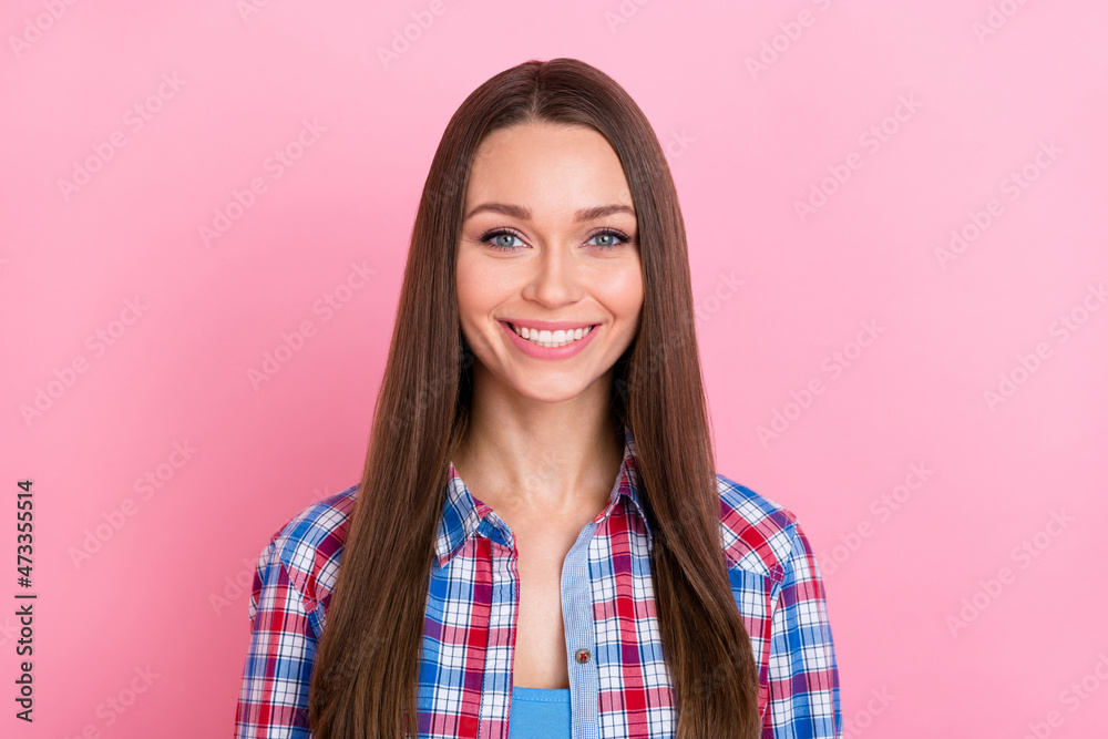 Photo of sweet brunette millennial lady wear plaid shirt isolated on pastel pink color background Photo of sweet brunette millennial lady wear plaid shirt isolated on pastel pink color background
