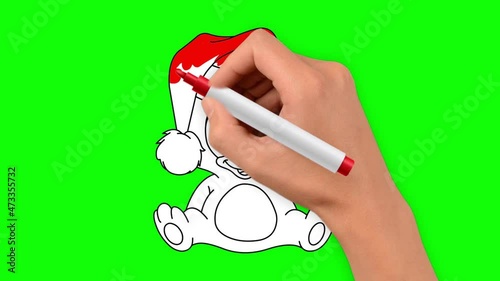 Christmas teddy bear is hand drawn on a green background. The bear is wearing a red Christmas hat.