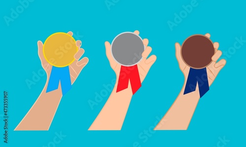 hand showing gold, brown, silver medal on white background