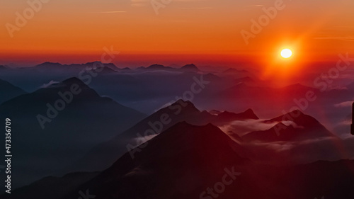 Beautiful alpine sunset view at the famous Zugspitze summit, top of germany, near Ehrwald, Tyrol, Austria and Garmisch-Partenkirchen, Bavaria, Germany