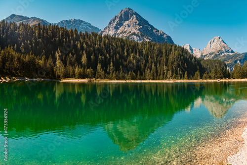 Fototapeta Naklejka Na Ścianę i Meble -  High resolution panorama of an alpine summer view with reflections in a lake and mountains in the background at the Ehrwalder Alm near Ehrwald, Tyrol, Austria