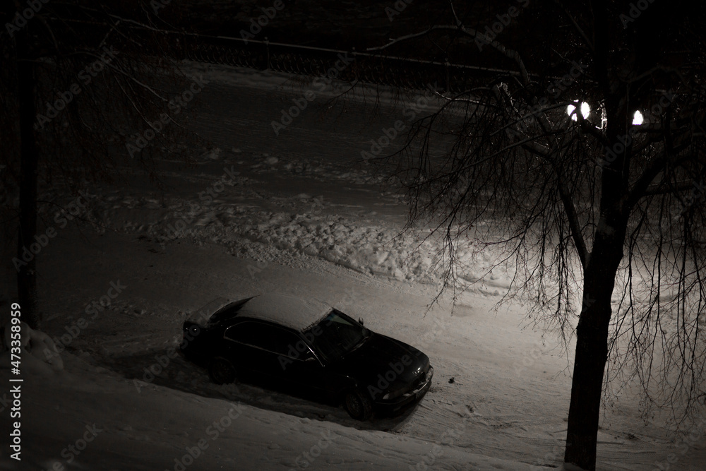 car in the parking lot in the evening car in the parking lot in the evening
