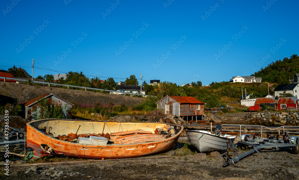 Landscape with wrecks of sloops in Norway
