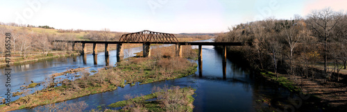Historic iron swing bridge over the White River, near Cotter Arkansas. Old steel truss bridge built in 1905, stretches 285 feet long.
