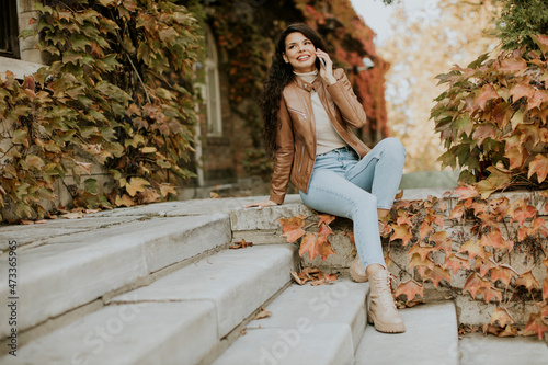 Young woman with mobile pho...
