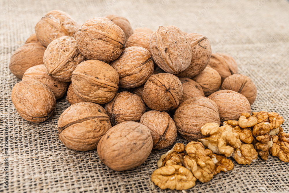 Close up view of walnuts on tabletop Close up view of walnuts on tabletop
