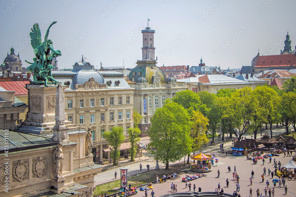 Side view of the Opera House in Lviv and top view of the central square near the fountain
