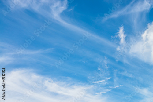 Scenic nature landscape with beautiful cirrus clouds in blue sky. Colorful cloudscape with spindrift clouds in blue sky. Nature background of sky with cirrostratus clouds. Natural cloudy sky backdrop. photo