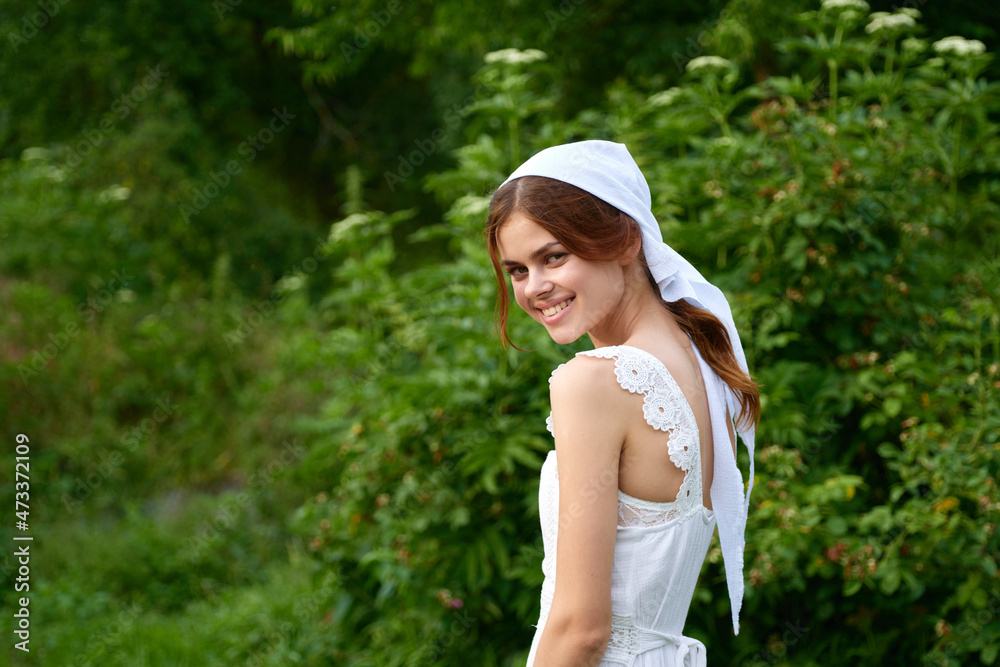 Woman in white dress in the village outdoors Green grass Farmer Woman in white dress in the village outdoors Green grass Farmer