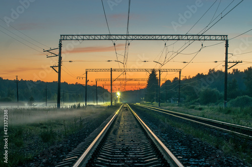 Railway station beautiful sunset landscape. Transportation system, railroad tracks