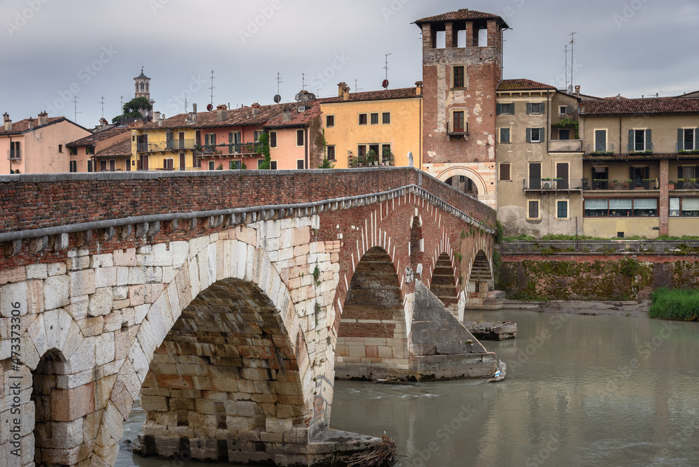 The famous Stone Bridge (Ponte di Piettra) over Adige river in Verona old town in the morning, Verona, Veneto Region, Italy