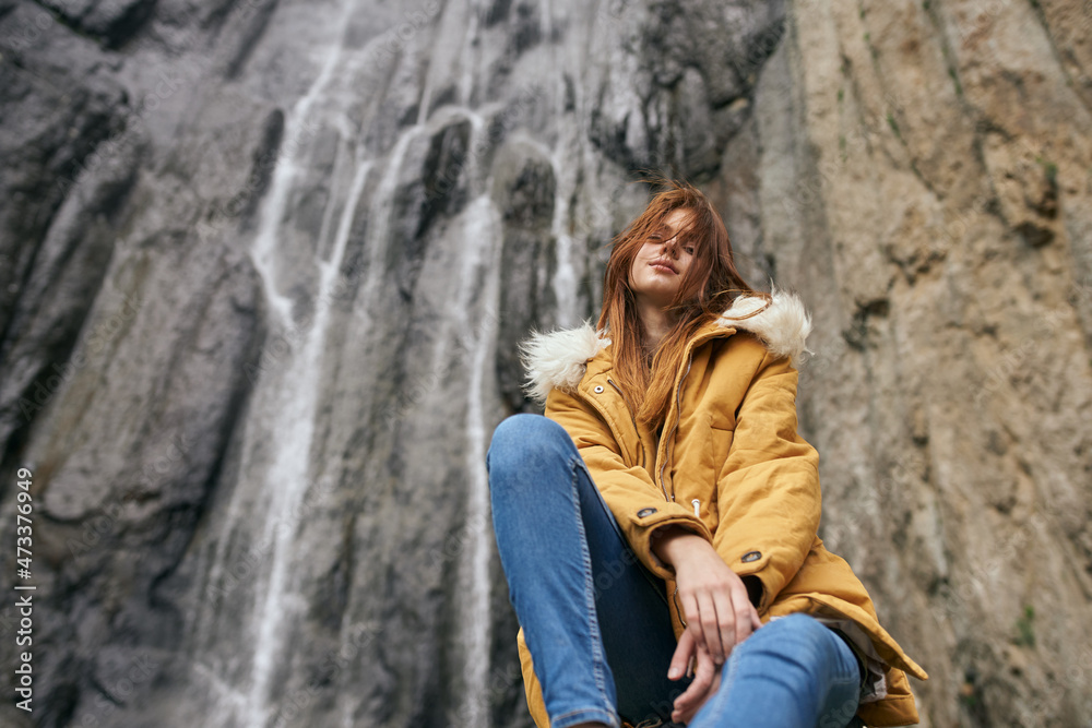 woman in yellow jacket hiking in the mountains travel adventure woman in yellow jacket hiking in the mountains travel adventure